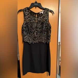 Black dress with gold embellished top